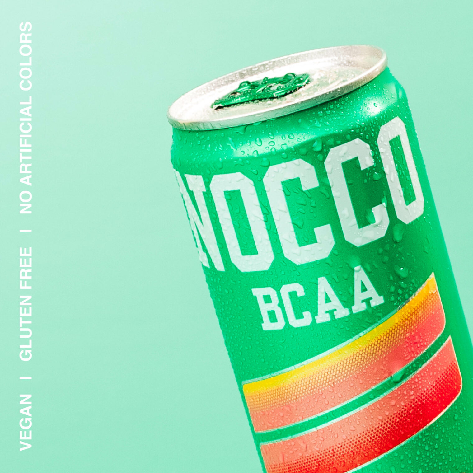 Green NOCCO BCAA can with water droplets on a teal background.